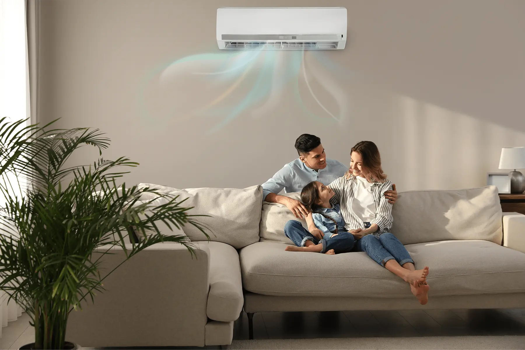 famille dans le canapé sous leurs climatisation pac air air
